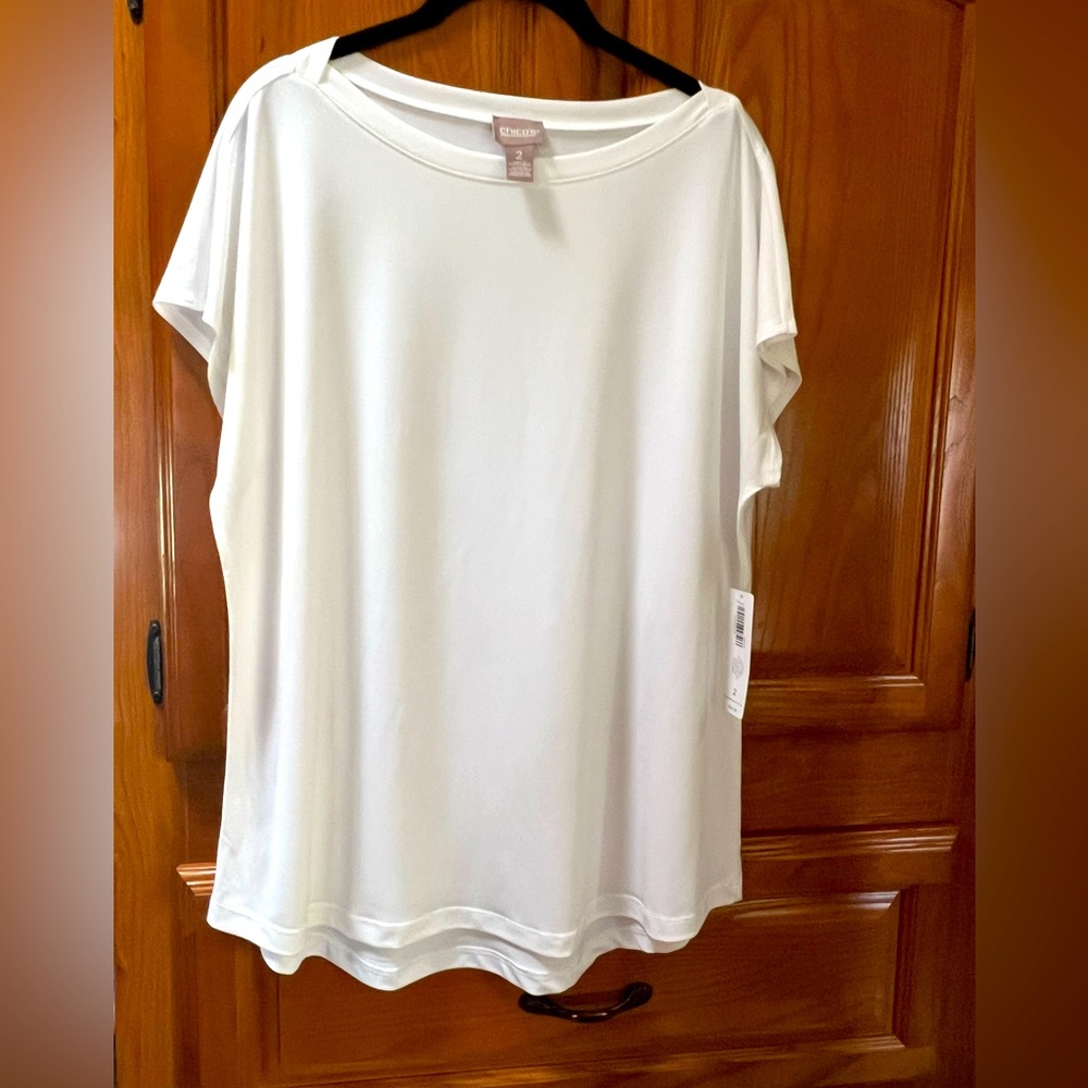 Chico’s Stella white boat top basic knit. New with tags. Size 2 Fits like L/XL.